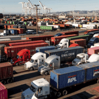 Trucks line up to enter a Port of Oakland shipping terminal on Wednesday, Nov. 10, 2021, in Oakland, California. [AP Photo/Noah Berger]